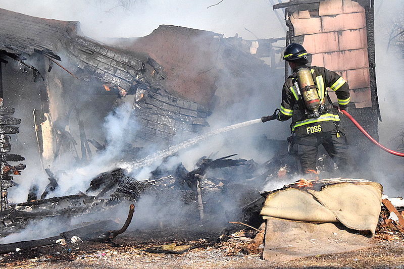 Grass fire burns house